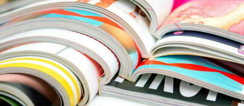 Stack of fashion magazines zoomed in.