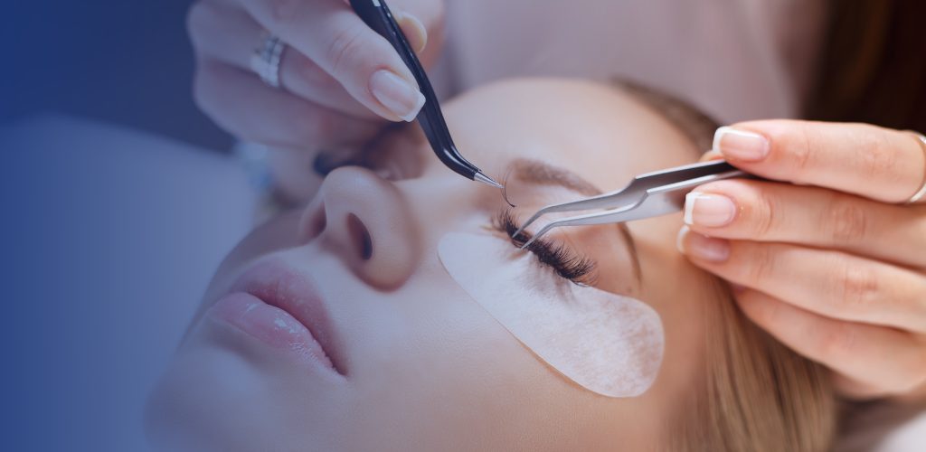 beautician applying false eyelashes to her customer, beauty treatment concept.lifestyle shot.