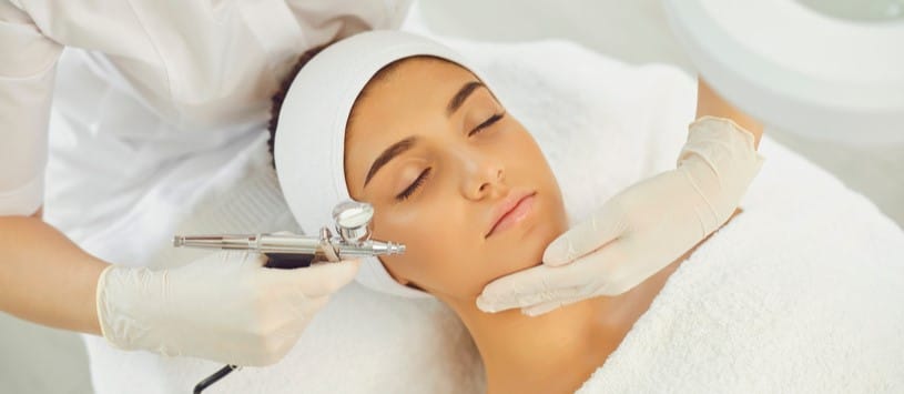 Female client receiving an oxygen facial treatment.