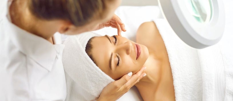 Female client receiving a Lymphatic Drainage Facial Massage treatment.